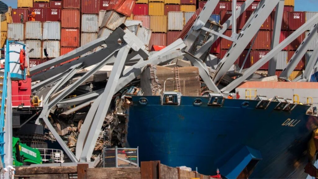 A salvage team works atop several containers on the MV Dali. Hundreds of engineering, construction and operations specialists support the Unified Command responding to the collapse of the Francis