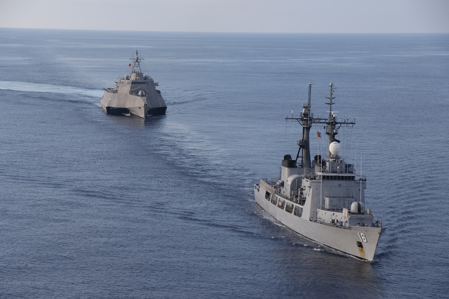 SOUTH CHINA SEA (July 31, 2024) – Independence-class littoral combat ship USS Mobile (LCS 26) conducts a Maritime Cooperative Activity with Philippine Navy’s Gregorio del Pilar-class patrol ship, BRP Ramon Alcaraz (PS 16), in the South China Sea, July 31, 2024. Mobile, part of Destroyer Squadron 7, is on a rotational deployment operating in the U.S. 7th Fleet area of operations to enhance interoperability with allies and partners and serve as a ready-response force in support of a free and open Indo-Pacific region. (U.S. Navy photo by Naval Aircrewman Tactical Helicopter 2nd Class Diego Chavez)