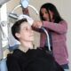 U.S. Navy Lt. (Dr.) Meghan Quinn (seated), a psychiatrist and chief of the Partial Hospitalization Program (PHP) at Walter Reed and Dr. Vanessa Torres-Llenza, staff psychiatrist at PHP, demonstrate the use of Transcranial Magnetic Stimulation (TMS), which can help treat depression and anxiety. (DOD photo by Quinton Lyons)