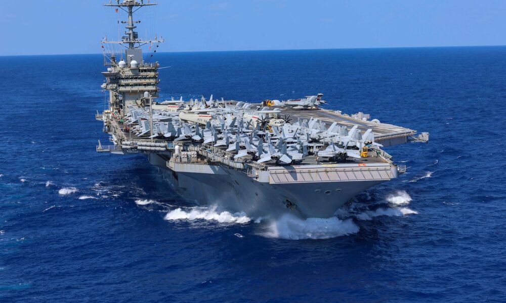 The Nimitz-class aircraft carrier USS Harry S. Truman (CVN 75), conducts a vertical replenishment-at-sea, Aug. 16.