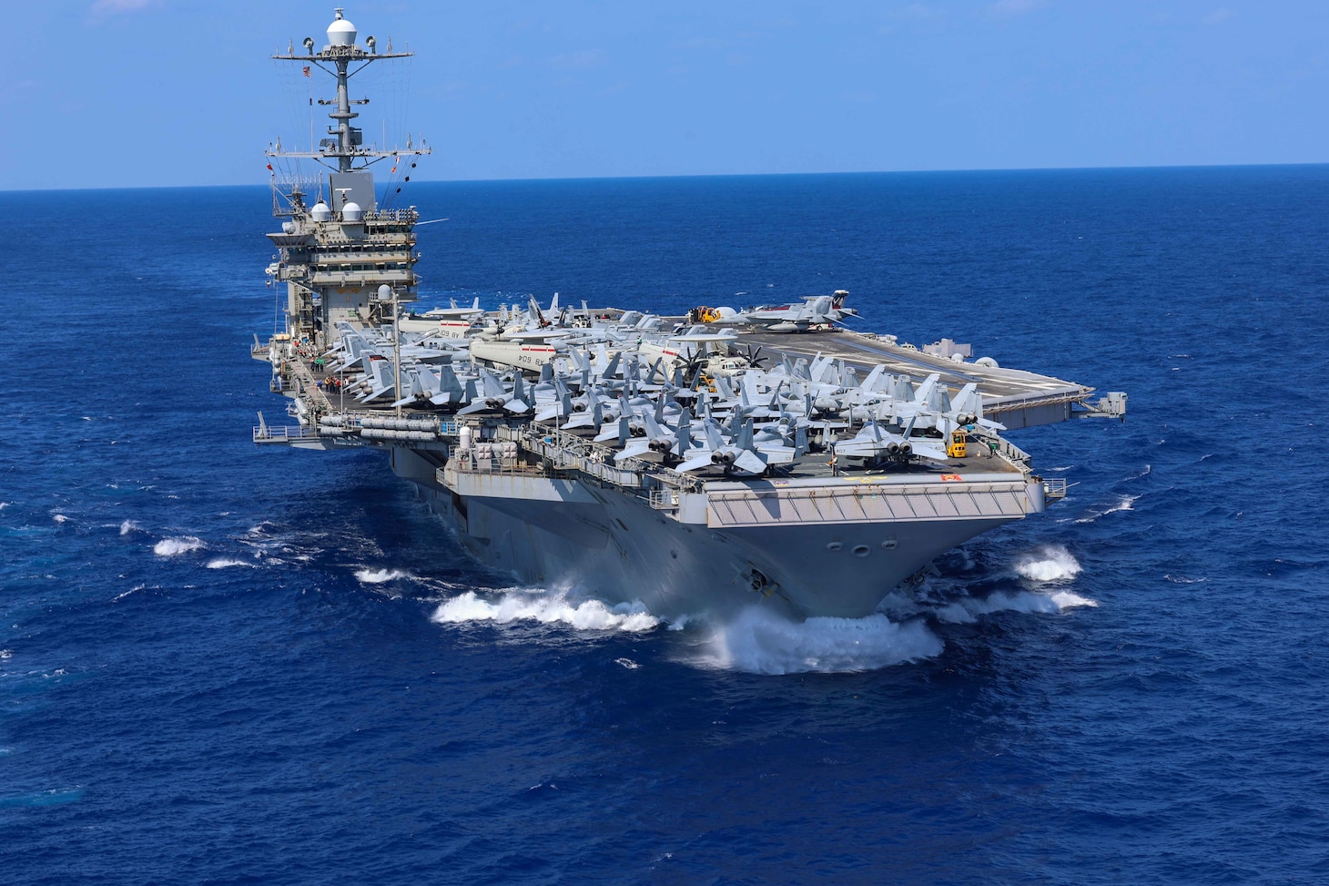 The Nimitz-class aircraft carrier USS Harry S. Truman (CVN 75), conducts a vertical replenishment-at-sea, Aug. 16.