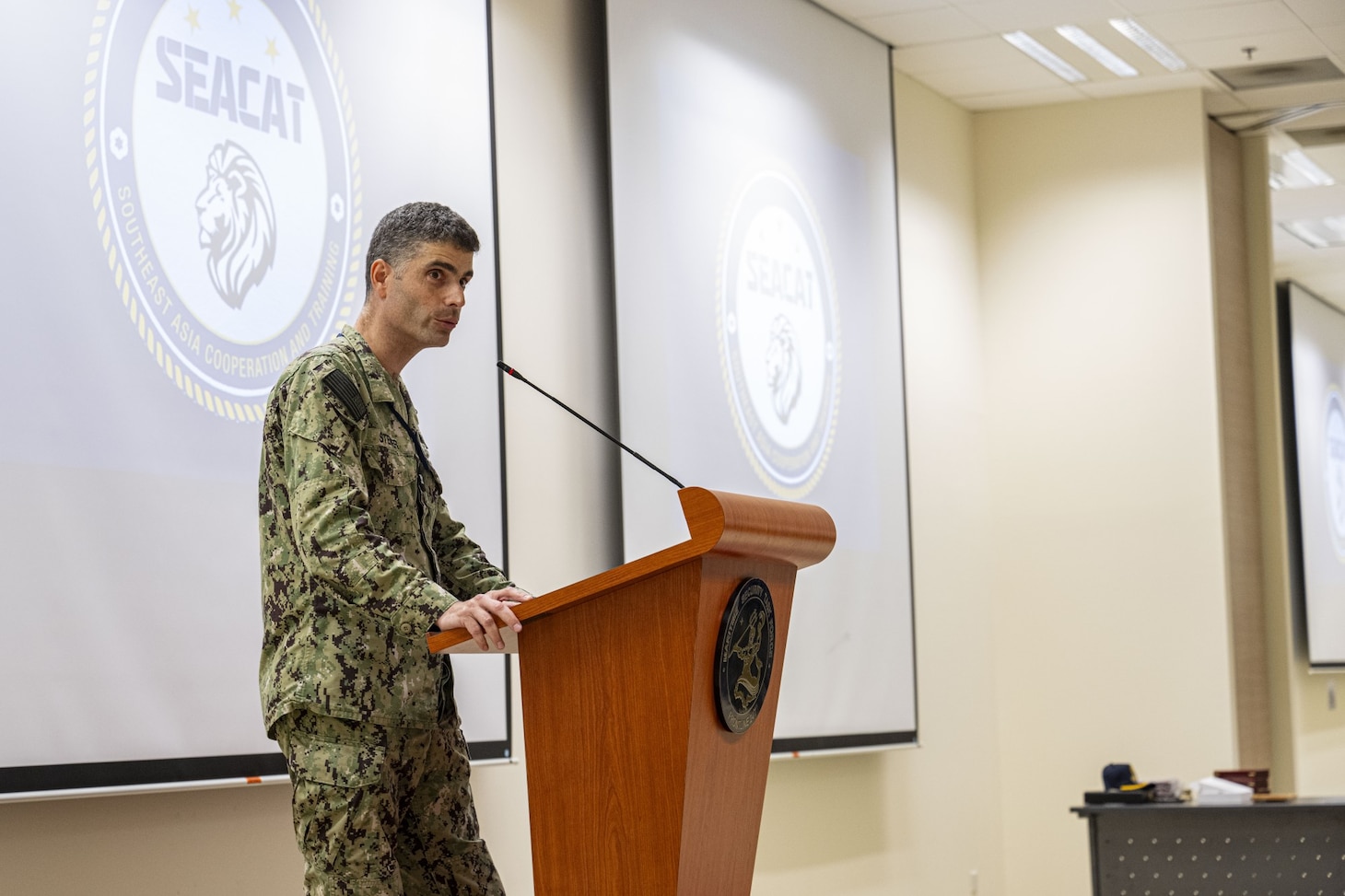 Capt. Axel Steiner, Chief of Staff assigned to Commander, Logistics Group Western Pacific/Task Force 73 (COMLOG WESTPAC), speaks during a workshop at the Southeast Asia Cooperation and Training (SEACAT) 2024 exercise at Changi Naval Base.