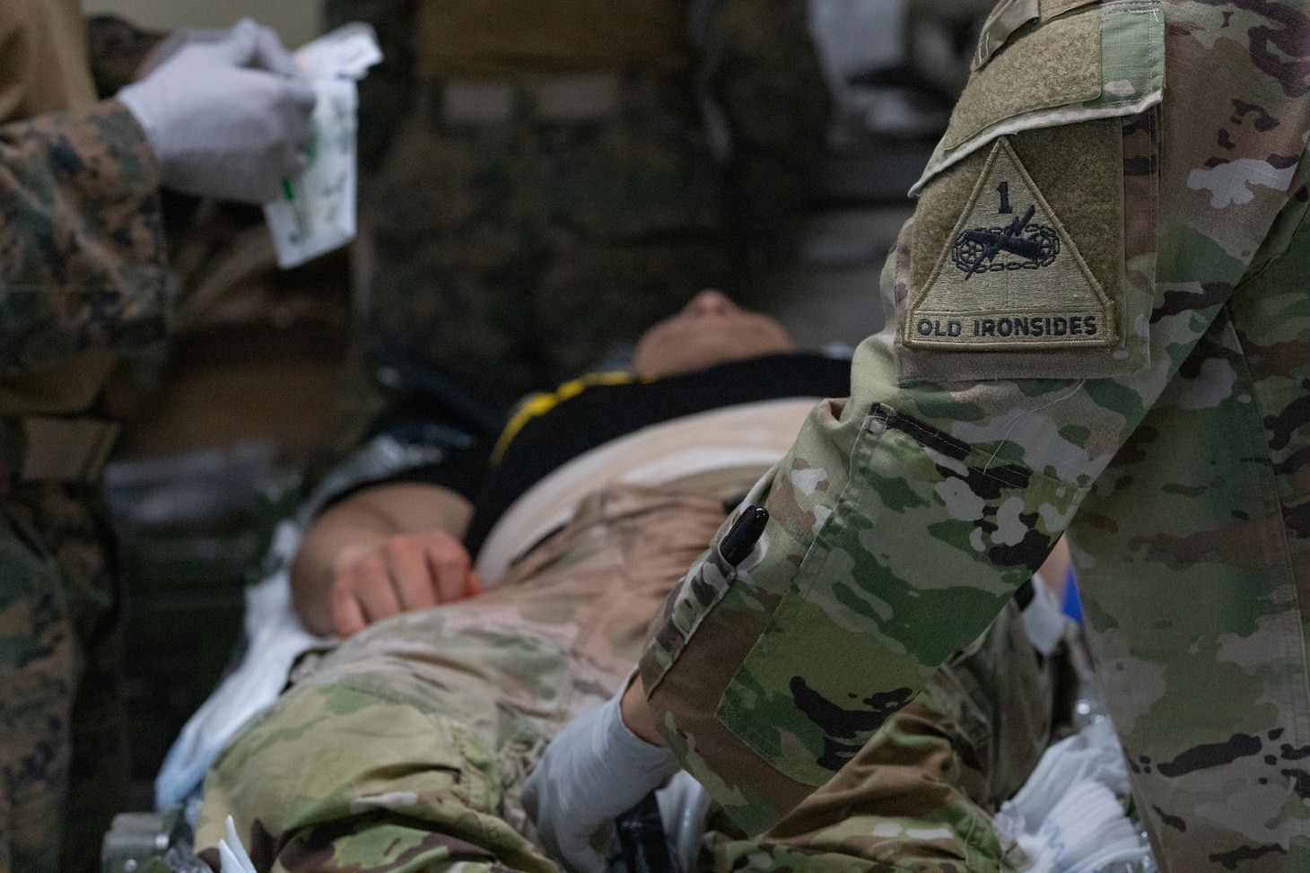 U.S. Army combat medics assigned to 4th Battalion, 70th Armor Regiment, 1st Armored Brigade Combat Team, 1st Armored Division, and U.S. Navy corpsmen assigned to 3rd Medical Battalion, 3rd Marine Logistics Group, engage in a rigorous cross-training exercise during Pacific Fortitude at Rodriguez Live Fire Complex, South Korea, August 13, 2024. Pacific Fortitude supports long-standing agreements to the Republic of Korea by deploying forces, drawing and supporting equipment to validate unit readiness and the U.S. commitment to the ROK-US alliance. (U.S. Army photo by Spc. Hunter Grice)