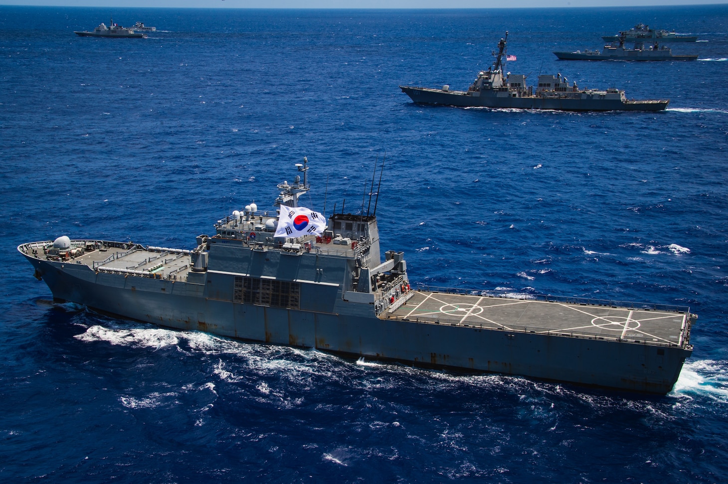 Republic of Korea Navy tank landing ship (LST 687) ROKS Cheon Ja Bong sails in formation during the at-sea phase of Exercise Rim of the Pacific (RIMPAC) 2024.