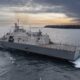 USS Nantucket transits the Menominee River.