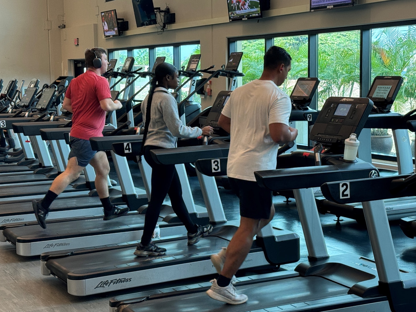 Gym goers run on new treadmills at the JBPHH Fitness Center.