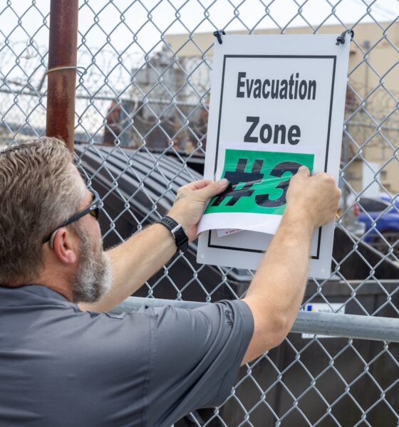 Evacuation Signage and Black Flags Help Protect Norfolk Naval Shipyard Workforce