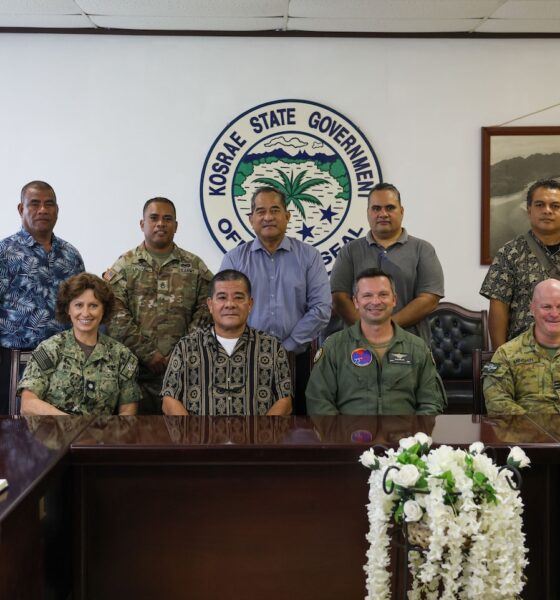 Pacific Partnership 2024-2 (PP24-2) service members take a group photo with government officials in Kosrae, Federated States of Micronesia.