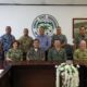 Pacific Partnership 2024-2 (PP24-2) service members take a group photo with government officials in Kosrae, Federated States of Micronesia.