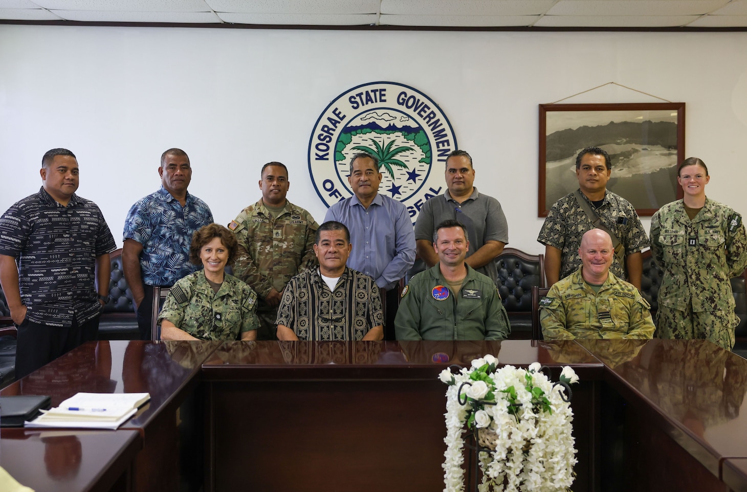 Pacific Partnership 2024-2 (PP24-2) service members take a group photo with government officials in Kosrae, Federated States of Micronesia.