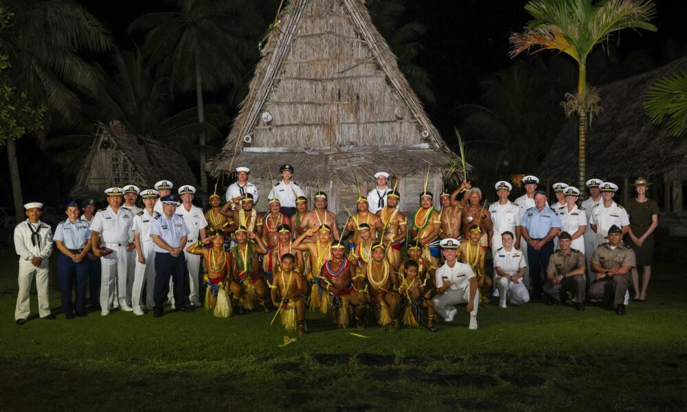 Service members assigned to Pacific Partnership 2024-2 and traditional Yapese dancers pose for a photo in Yap, Federated States of Micronesia, (U.S. Navy photo by Mass Communication Specialist Seaman Gavin Arnoldhendershot)