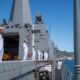 Sailors man the rails aboard USS San Diego (LPD 22) as it arrives at Fleet Activities Sasebo.