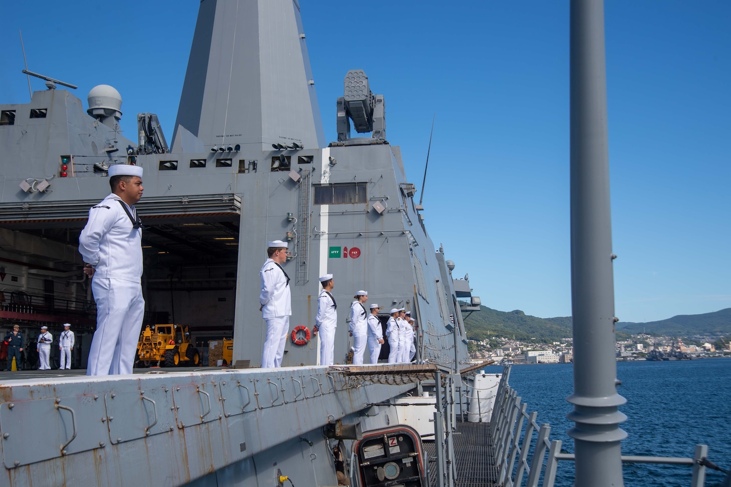 Sailors man the rails aboard USS San Diego (LPD 22) as it arrives at Fleet Activities Sasebo.