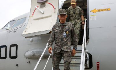 Rear Adm. Kang Jeong-ho, commander, Republic of Korea Navy Submarine Force Command, and Rear Adm. Chris Cavanaugh, commander, Submarine Group (CSG) 7, visit a P-8A Poseidon assigned to maritime patrol (VP) squadron 10 at Naval Air Facility Atsugi, Sept. 27, 2024, during the Submarine Warfare Committee Meeting (SWCM).