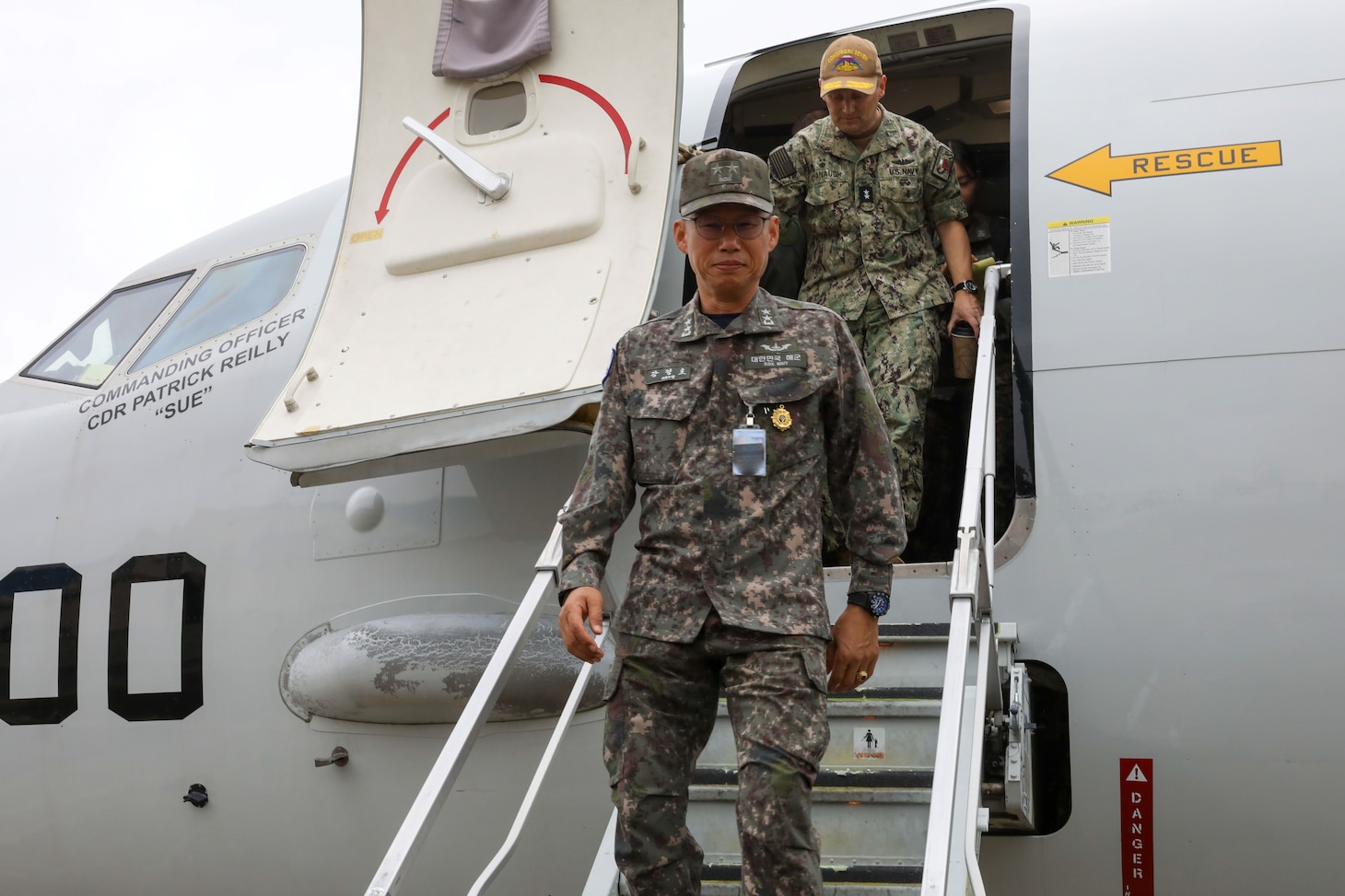 Rear Adm. Kang Jeong-ho, commander, Republic of Korea Navy Submarine Force Command, and Rear Adm. Chris Cavanaugh, commander, Submarine Group (CSG) 7, visit a P-8A Poseidon assigned to maritime patrol (VP) squadron 10 at Naval Air Facility Atsugi, Sept. 27, 2024, during the Submarine Warfare Committee Meeting (SWCM).