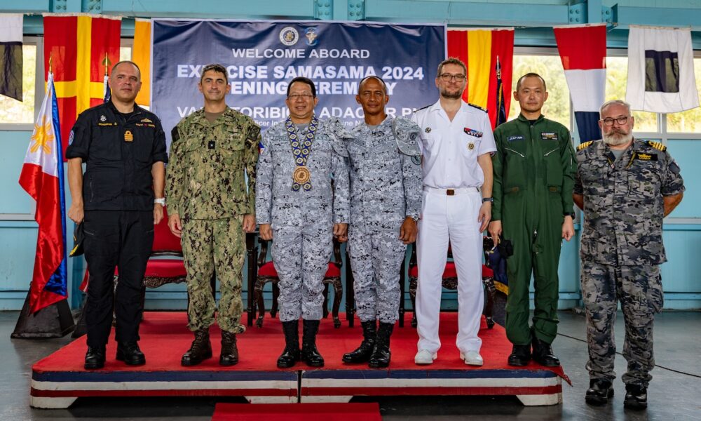 Rear Adm. Todd Cimicata, Commander, Logistics Group Western Pacific/Task Force 73 (COMLOG WESTPAC/CTF 73) (left) poses for a photo with Rear Adm. Jose Ma Ambrosio Q. Ezpeleta, Vice Commander, Philippine Navy, (middle) and Commodore Edward Ike Morada De Sagon, Commander, Naval Forces Northern Luzon (right) at the opening ceremony of Exercise Sama Sama, on Naval Operating Base-Subic.