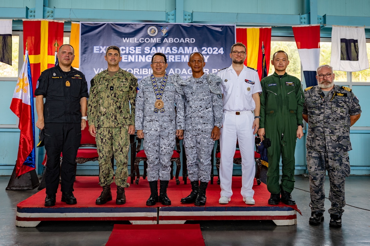 Rear Adm. Todd Cimicata, Commander, Logistics Group Western Pacific/Task Force 73 (COMLOG WESTPAC/CTF 73) (left) poses for a photo with Rear Adm. Jose Ma Ambrosio Q. Ezpeleta, Vice Commander, Philippine Navy, (middle) and Commodore Edward Ike Morada De Sagon, Commander, Naval Forces Northern Luzon (right) at the opening ceremony of Exercise Sama Sama, on Naval Operating Base-Subic.