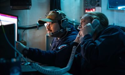 Cryptologic Technician (Technical) 1st Class Matthew Salazar, from Chicago, center, and Senior Chief Cryptologic Technician (Technical) Amy Woolston, from Jacksonville, North Carolina, both assigned to Commander, Task Force 70, embarked on U.S. 7th Fleet’s premiere forward-deployed aircraft carrier USS George Washington (CVN 73), maintain Carrier Strike Group 5 battlespace awareness while standing watch for the information warfare commander in the tactical flag command center while underway in the Pacific Ocean, during Keen Sword 25, Oct. 26.