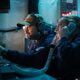 Cryptologic Technician (Technical) 1st Class Matthew Salazar, from Chicago, center, and Senior Chief Cryptologic Technician (Technical) Amy Woolston, from Jacksonville, North Carolina, both assigned to Commander, Task Force 70, embarked on U.S. 7th Fleet’s premiere forward-deployed aircraft carrier USS George Washington (CVN 73), maintain Carrier Strike Group 5 battlespace awareness while standing watch for the information warfare commander in the tactical flag command center while underway in the Pacific Ocean, during Keen Sword 25, Oct. 26.