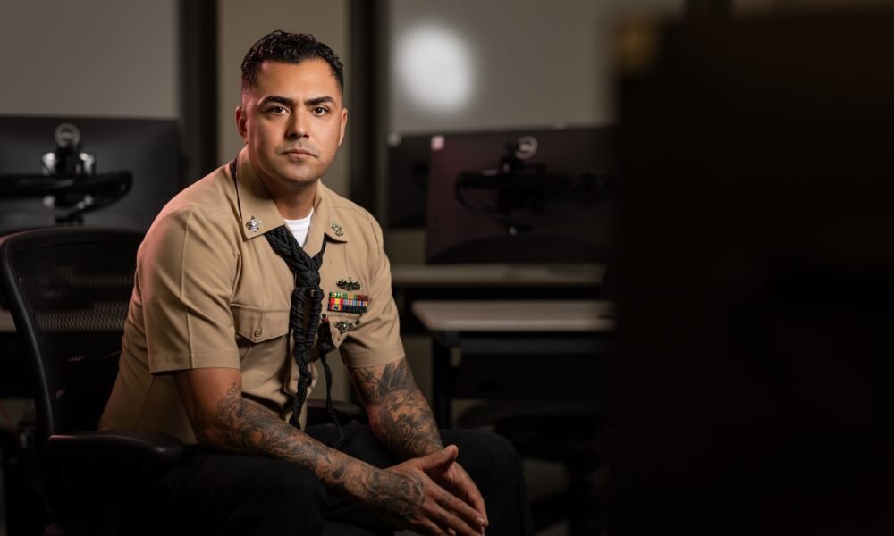 Boatswain's Mate 1st Class Gustavo Benavides, assigned to Surface Combat Systems Training Command (SCSTC), poses for a portrait at the Littoral Combat Ship Training Facility Pacific (LTFPAC) onboard Naval Base San Diego on Sept. 18, 2024. Benavides provides mentorship and training to junior Sailors, ensuring they are prepared for their operational roles within the U.S. Navy. (U.S. Navy photo by Austen McClain)