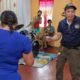 Civilian mariner Larry P. Ejan, steward utilityman, with Military Sealift Command’s (MSC) dry cargo and ammunition ship USNS Charles Drew (T-AKE 10), dances with a staff member of the Niños Pag Asa Orphanage Center, during a community outreach event in Olongapo, Philippines, Dec. 8, 2024.